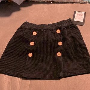 Black skirt with brown buttons